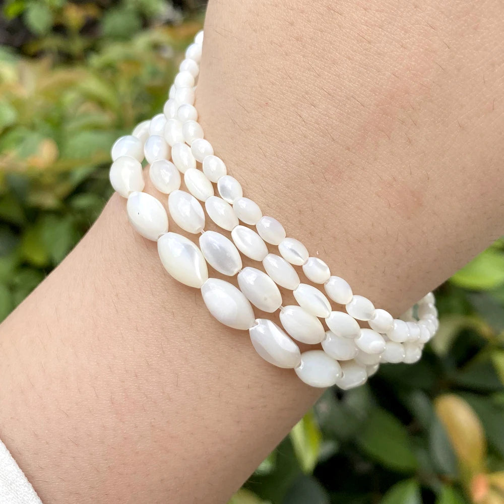 White oval shell beads in various sizes