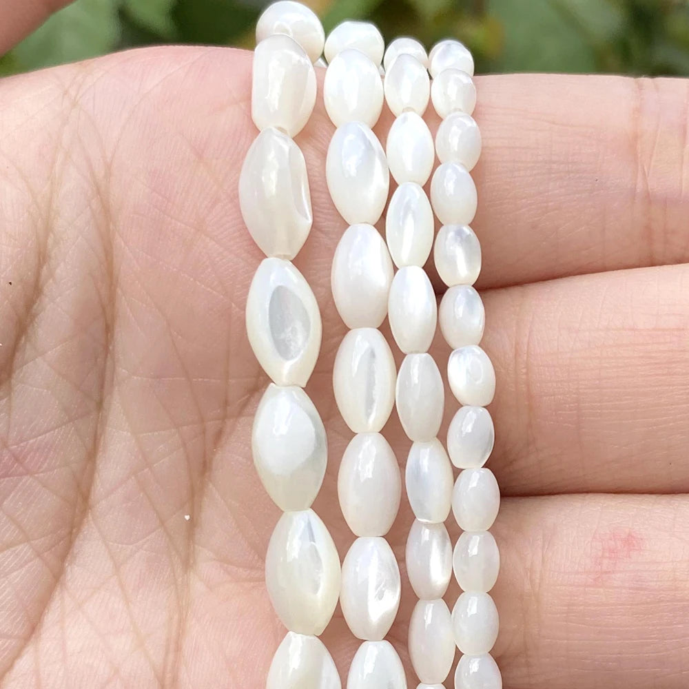 White oval shell beads in various sizes