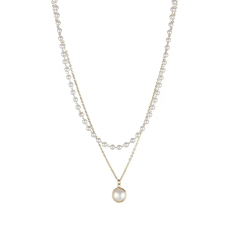 Dubbel halsband 18k guld med vita pärlor