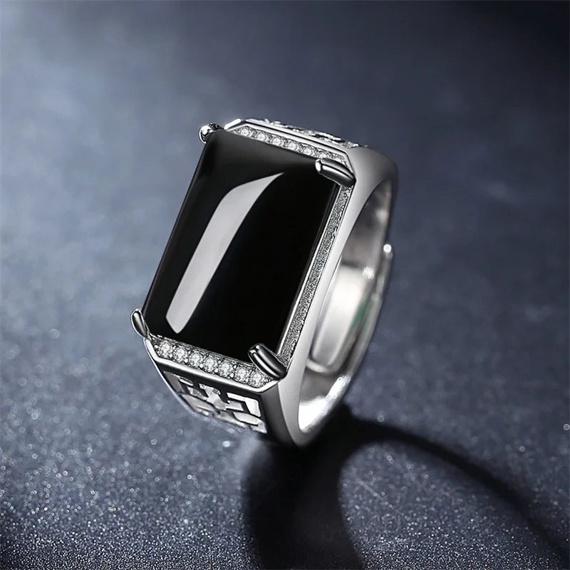 Wide ring in genuine silver with a crystal stone in the middle.