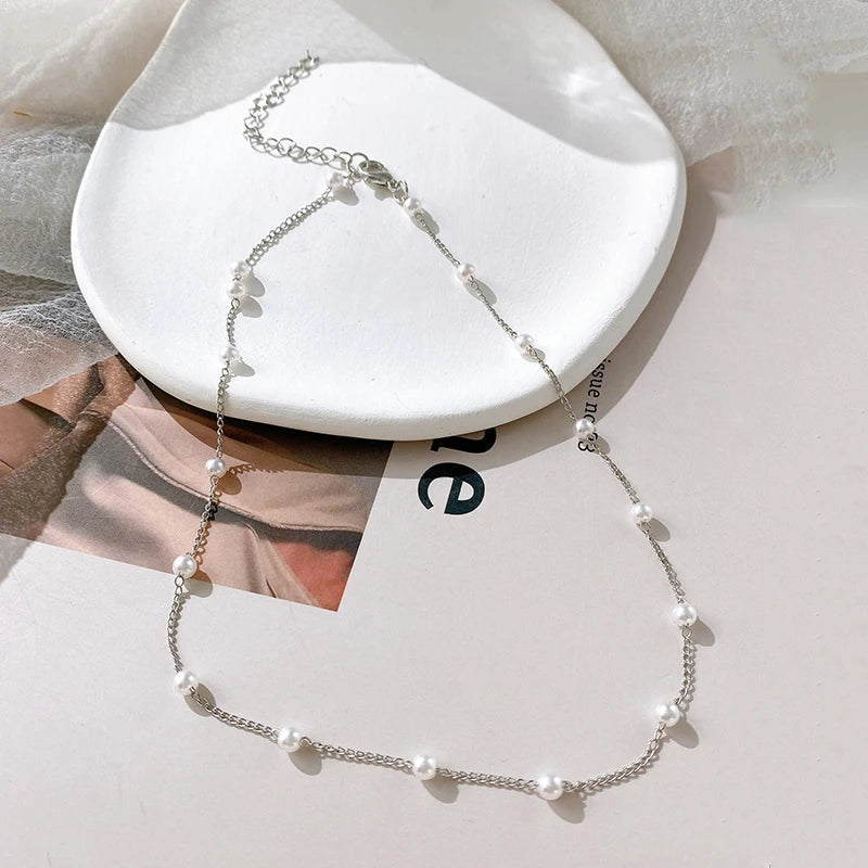 Matchande halsband och örhängen med kedja och pearls