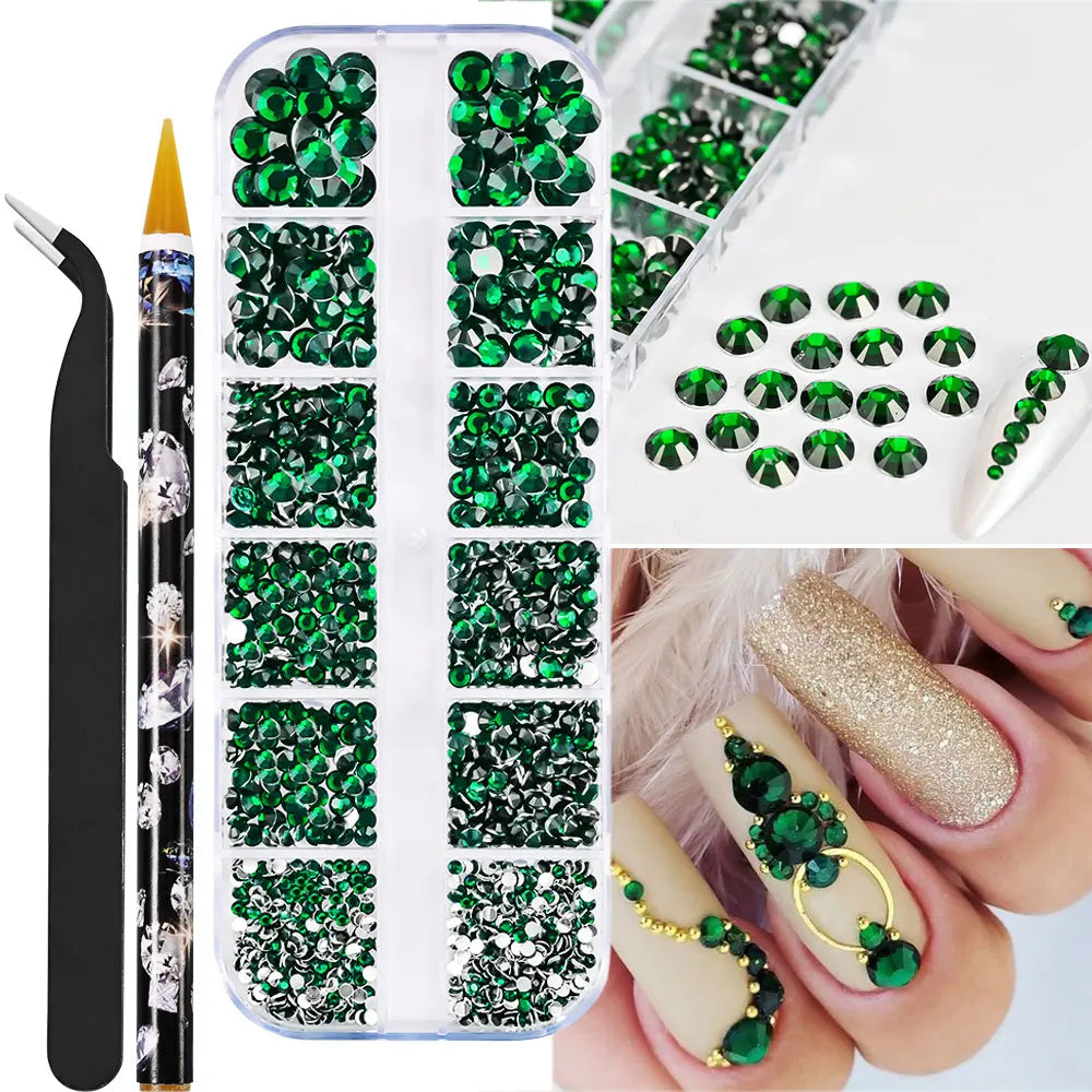 Låda med små pearls eller strass stenar med verktyg