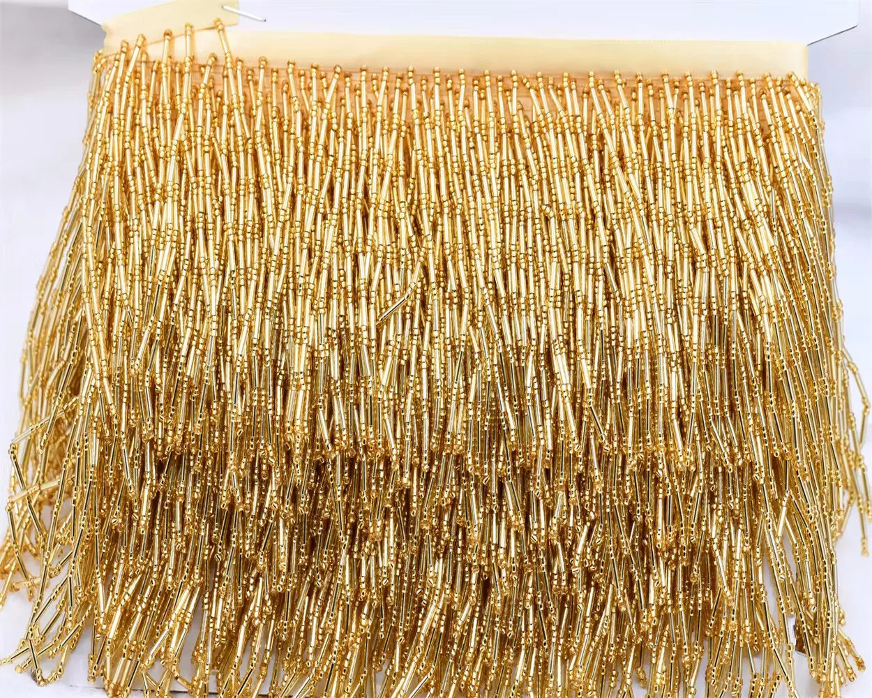 Tassel med glaspärlor