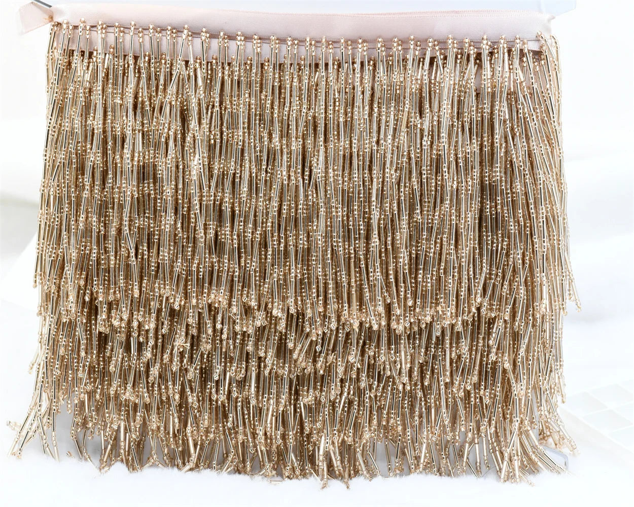 Tassel med glaspärlor
