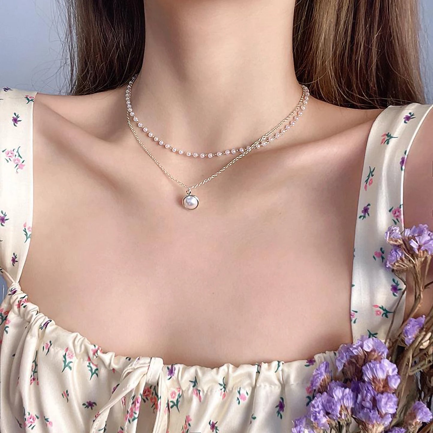 Dubbel halsband 18k guld med vita pärlor