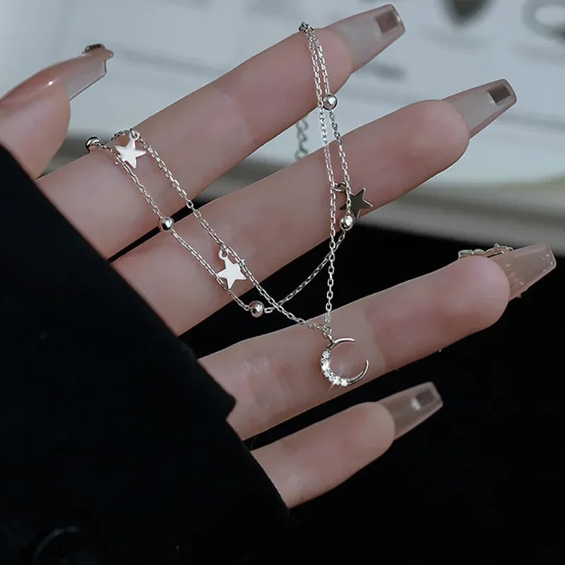 Armband med måne&stjärna berlocker i äkta silver