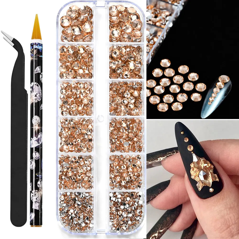 Låda med små pearls eller strass stenar med verktyg