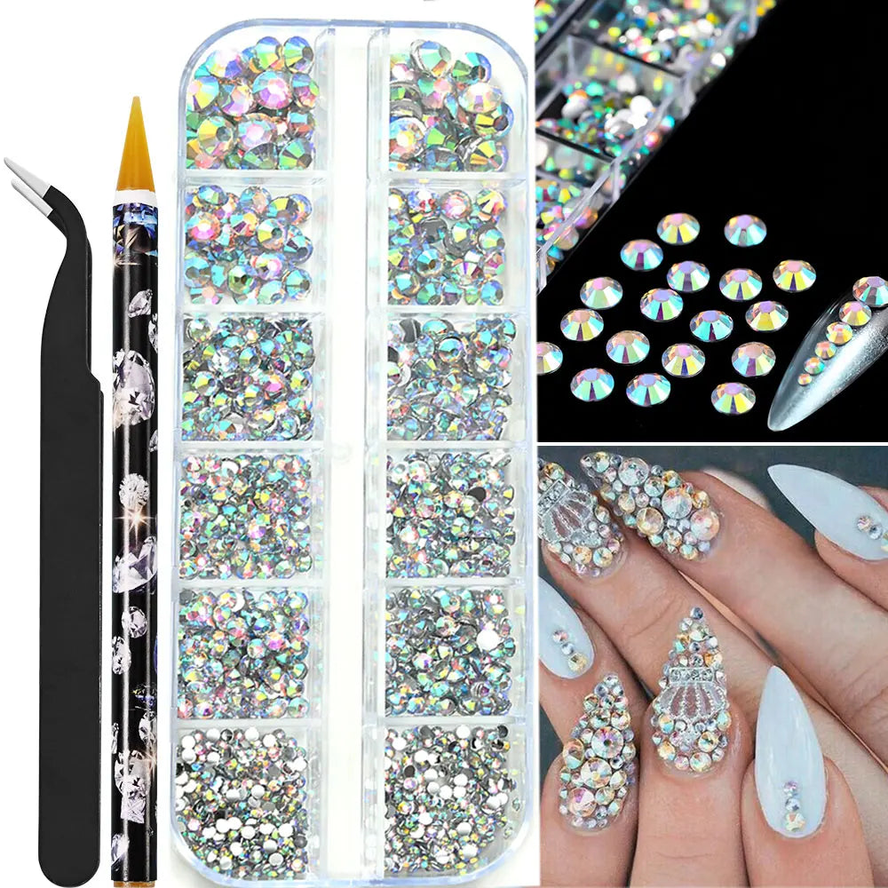 Låda med små pearls eller strass stenar med verktyg