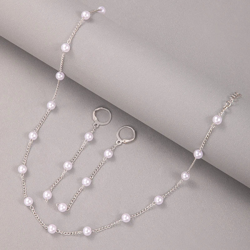 Matchande halsband och örhängen med kedja och pearls