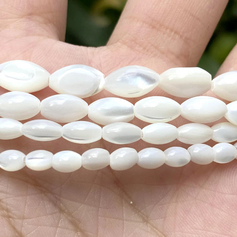 White oval shell beads in various sizes