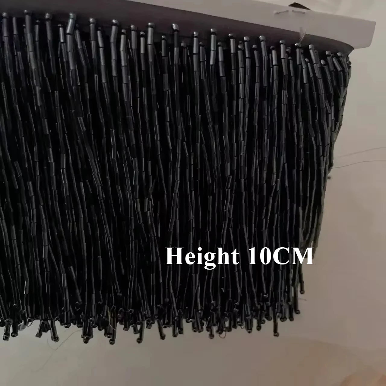 Tassel med tub pärlor på längd