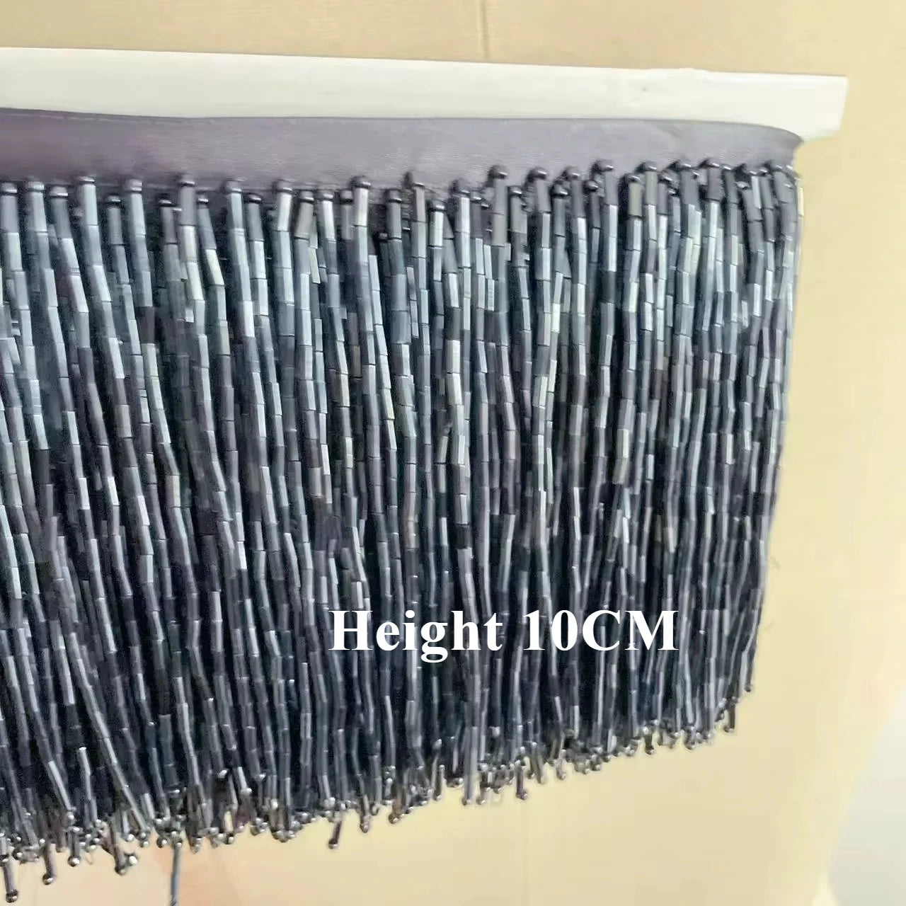 Tassel med tub pärlor på längd