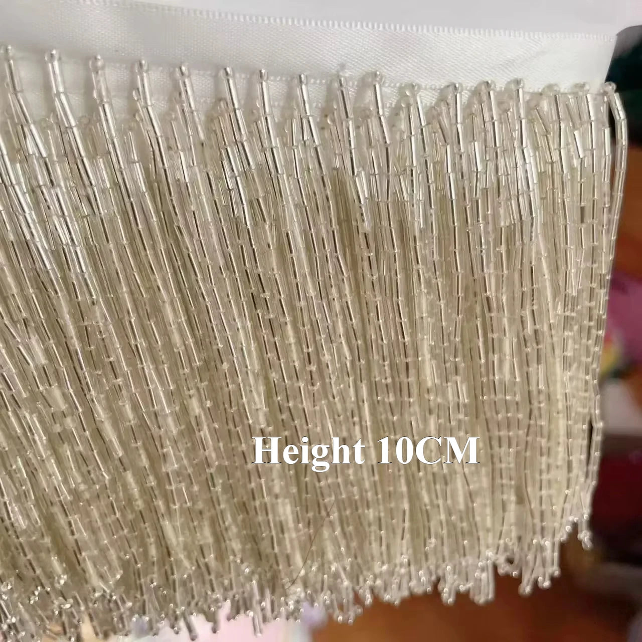 Tassel med tub pärlor på längd