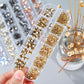 Box with rhinestones of different shapes