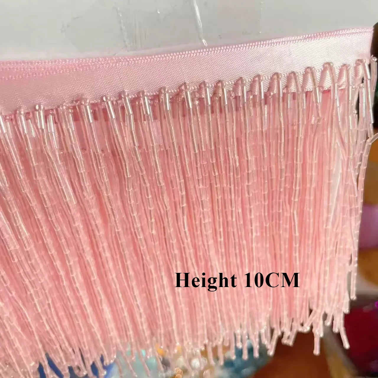 Tassel med tub pärlor på längd