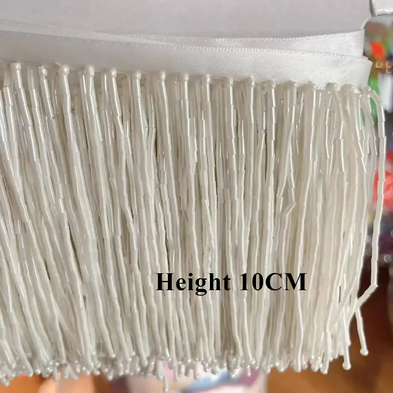 Tassel med tub pärlor på längd