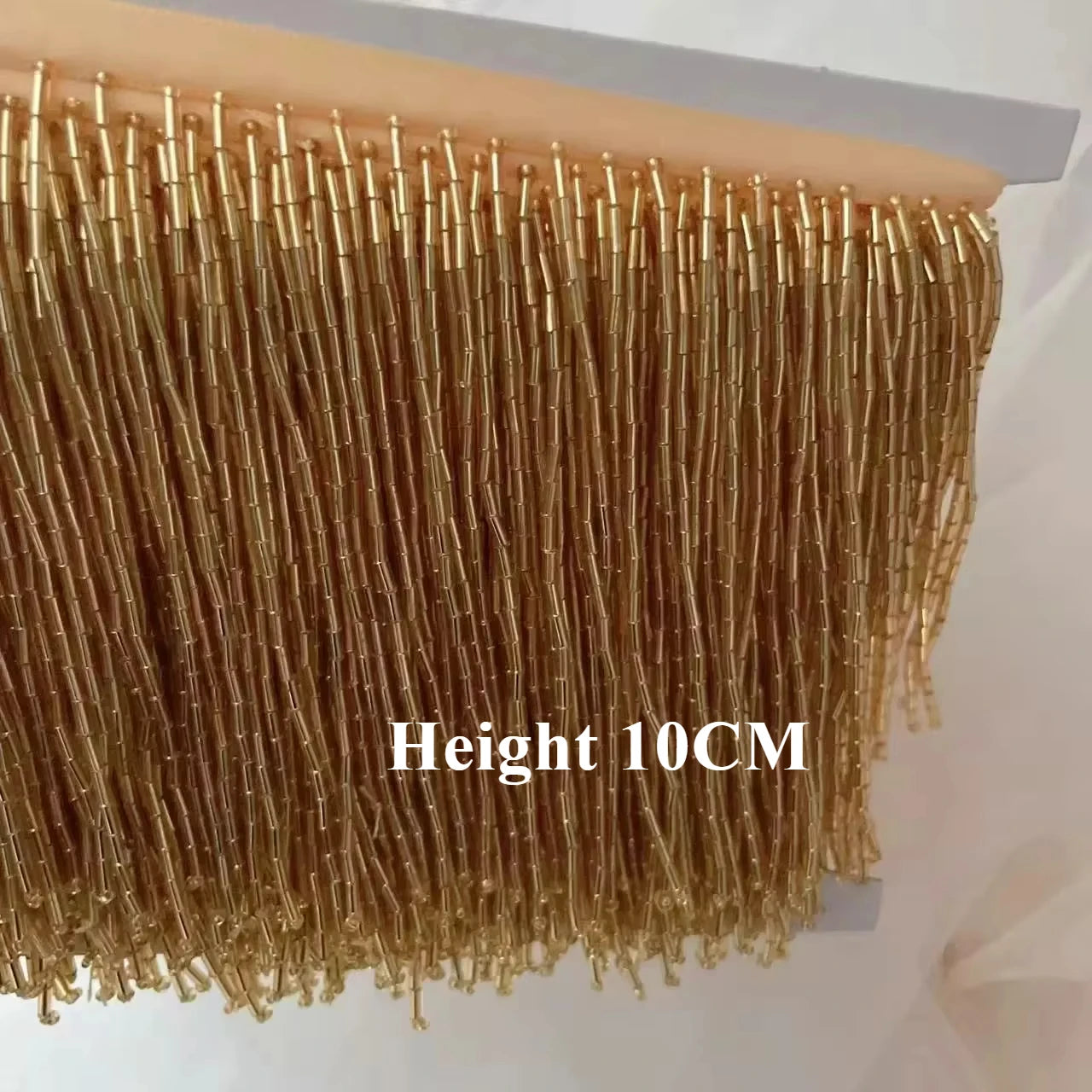 Tassel med tub pärlor på längd