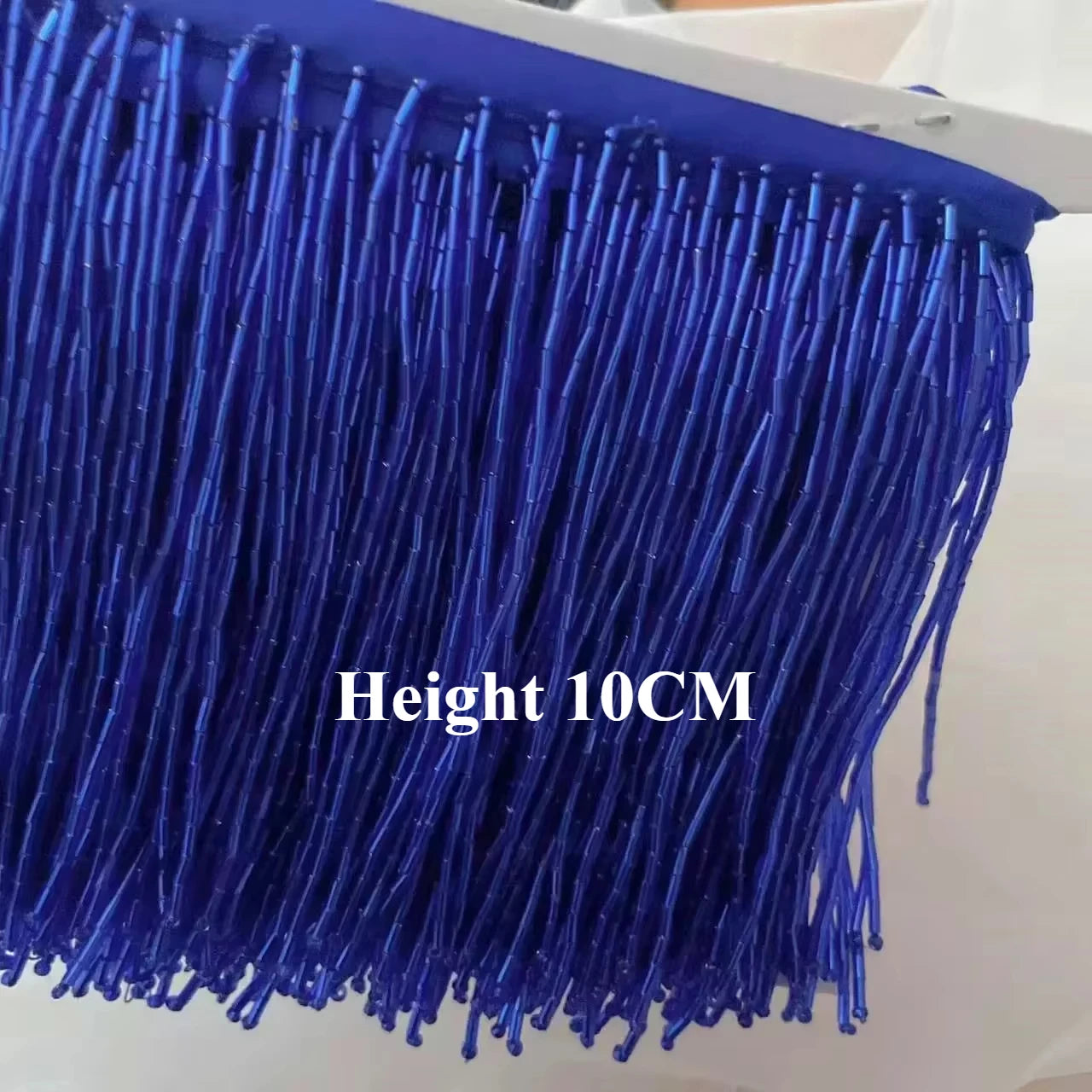 Tassel med tub pärlor på längd