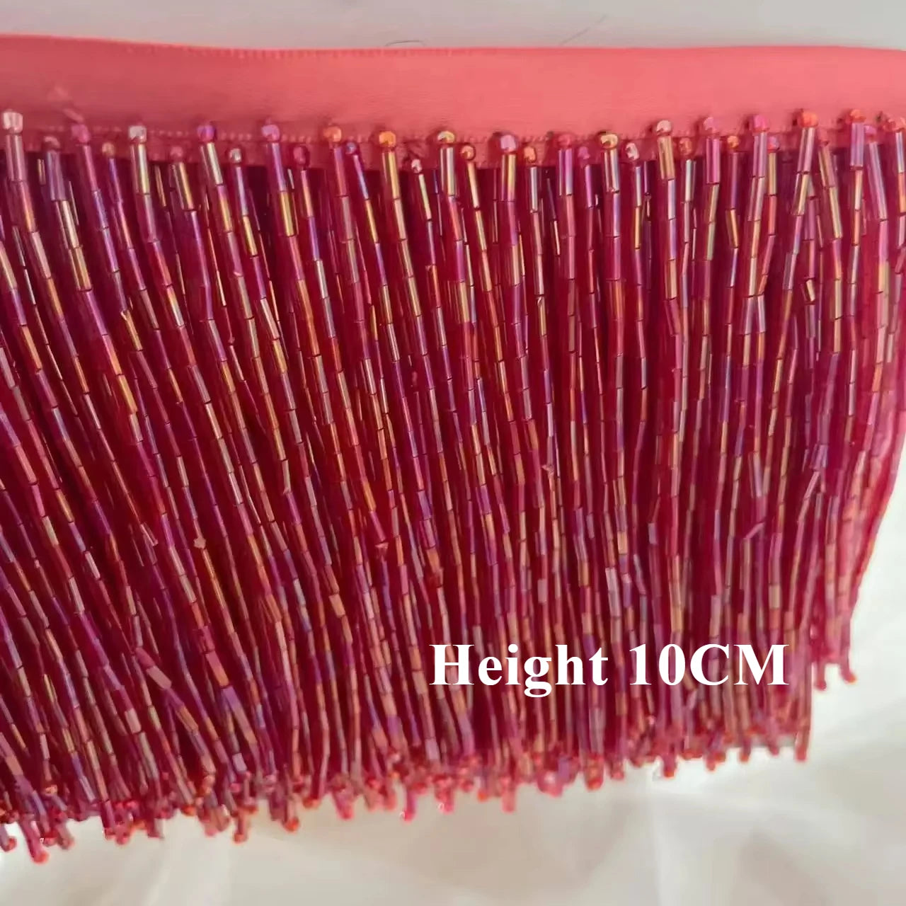 Tassel med tub pärlor på längd