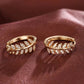 Earrings hoops with leaves in rhinestones