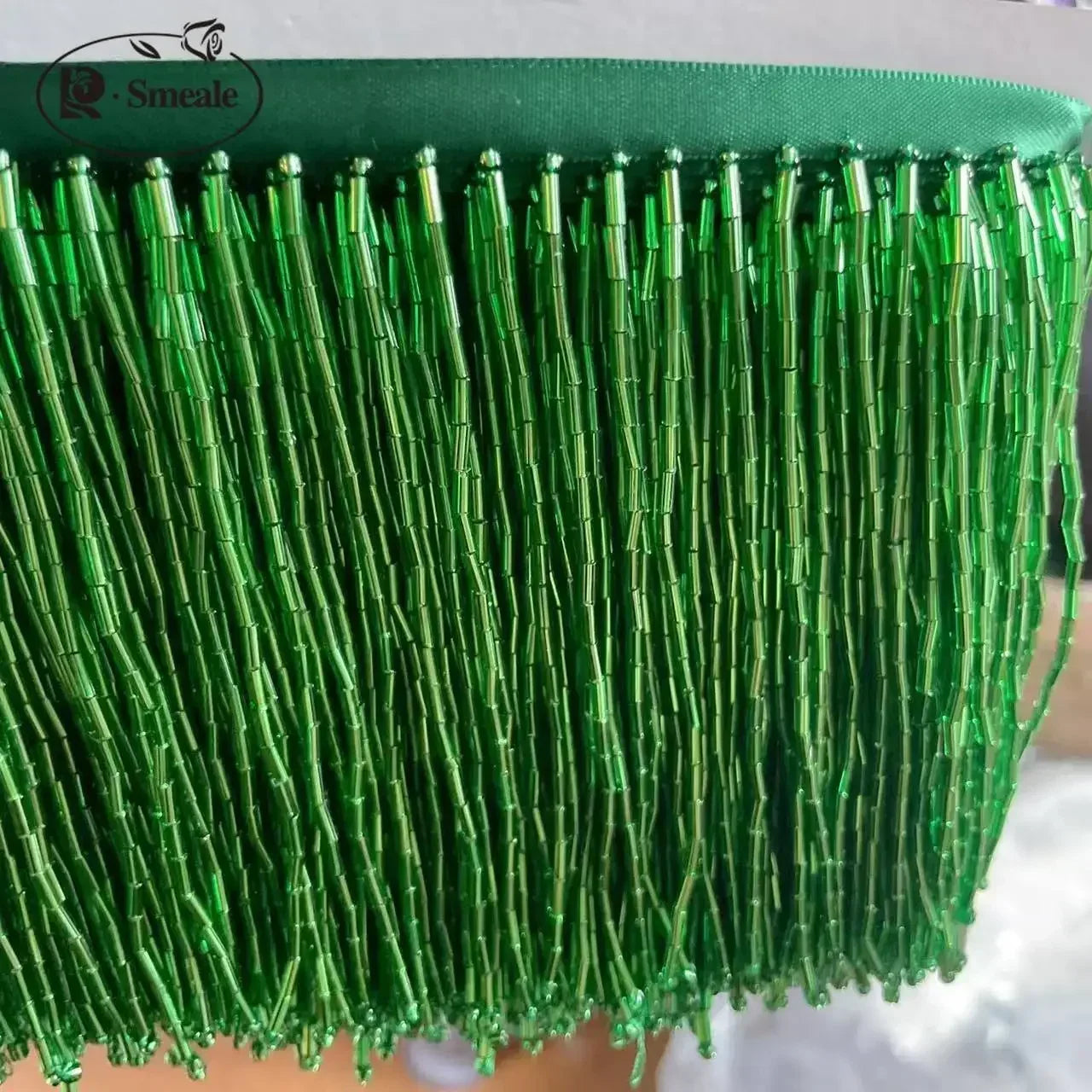 Tassel med tub pärlor på längd