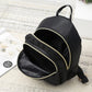 Small black backpack with multiple compartments 
