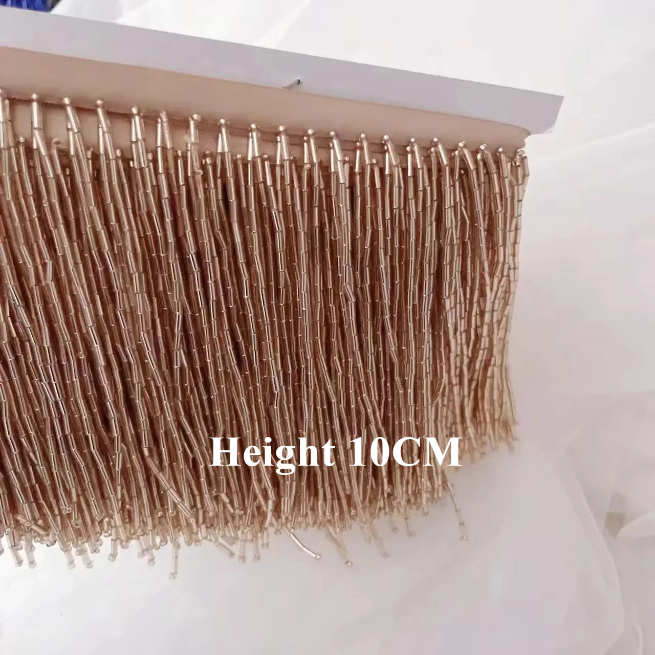 Tassel med tub pärlor på längd