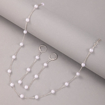 Matchande halsband och örhängen med kedja och pearls